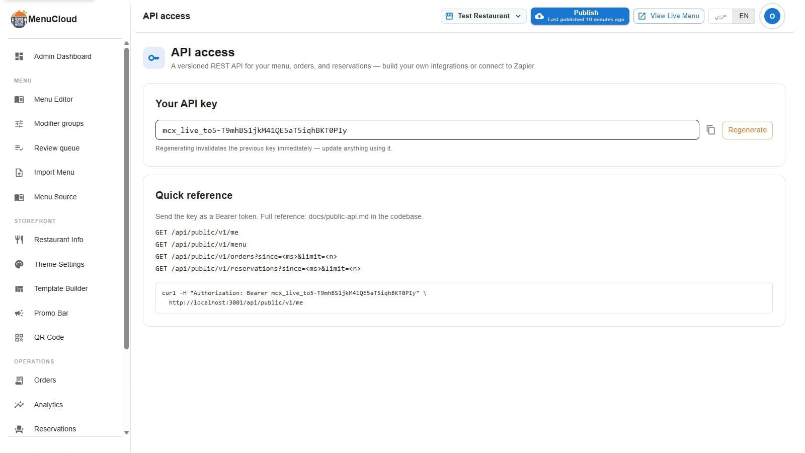صفحة الوصول للـ API في لوحة تحكم menu-MENA، فيها حقل مفتاح API مخفي مع زرار نسخ وزرار إعادة إنشاء، ومثال curl جاهز، وقائمة مرجعية بأربع نقاط الوصول المتاحة.